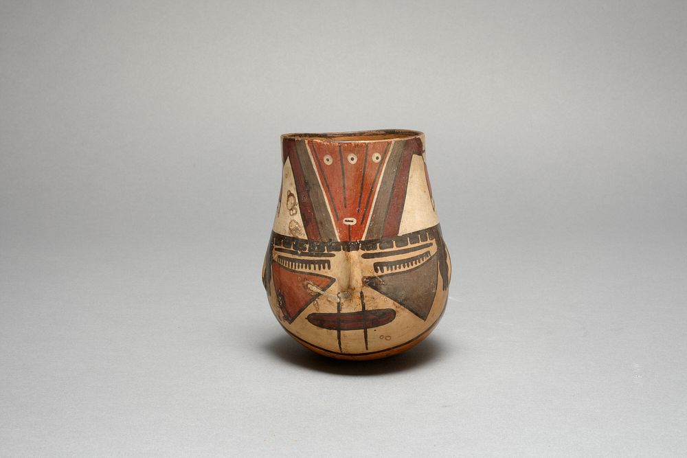 Beaker in the Form of a Trophy Head with Bound Lips by Nazca