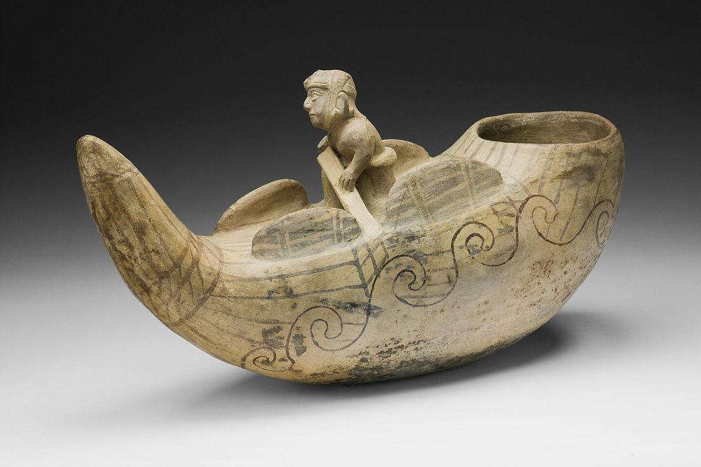 Vessel in the Form of a Fisherman in a Reed Boat by Moche