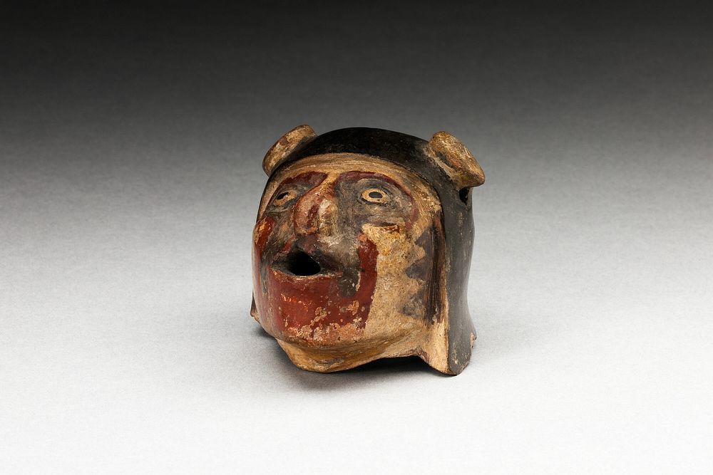 Fragment of a Vessel or Sculpture Depicting a Human Head by Tiwanaku