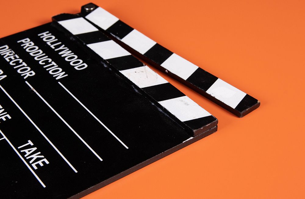 Movie clapper, film production advertising.