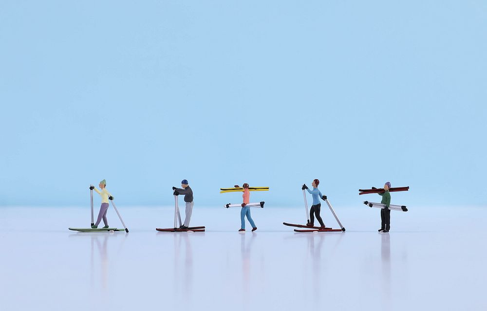 Miniature skiers, extreme sport advertising.