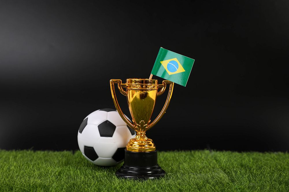 Golden trophy and football ball with flag of Brasil📝 I am a huge supporter of Open Knowledge and appreciate any creative…