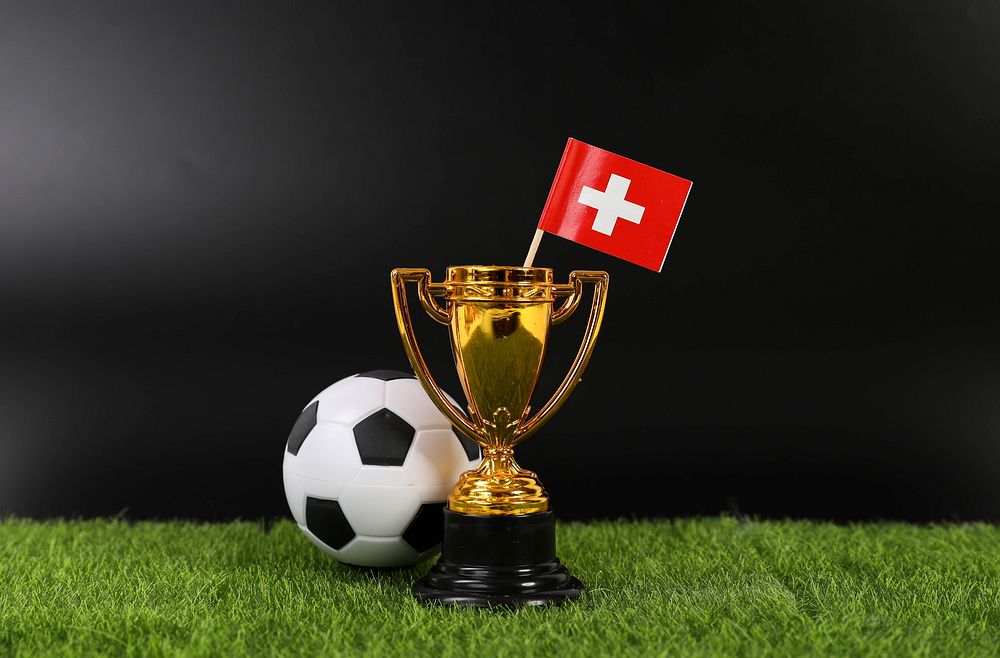 Golden trophy and football ball with flag of Switzerland📝 I am a huge supporter of Open Knowledge and appreciate any…