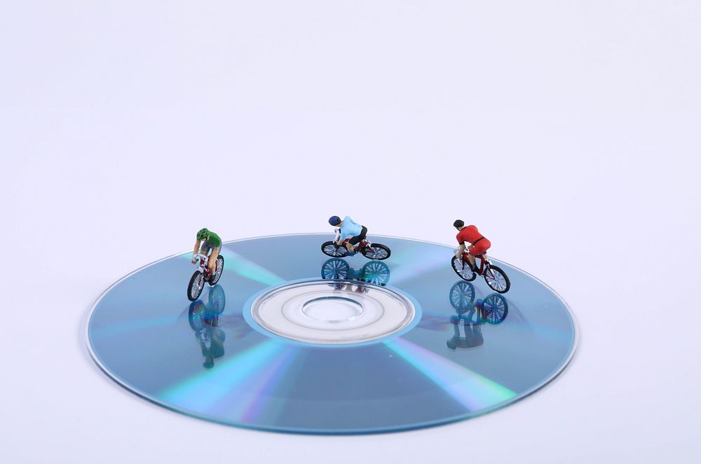 Disc cyclists, miniature sport advertising.