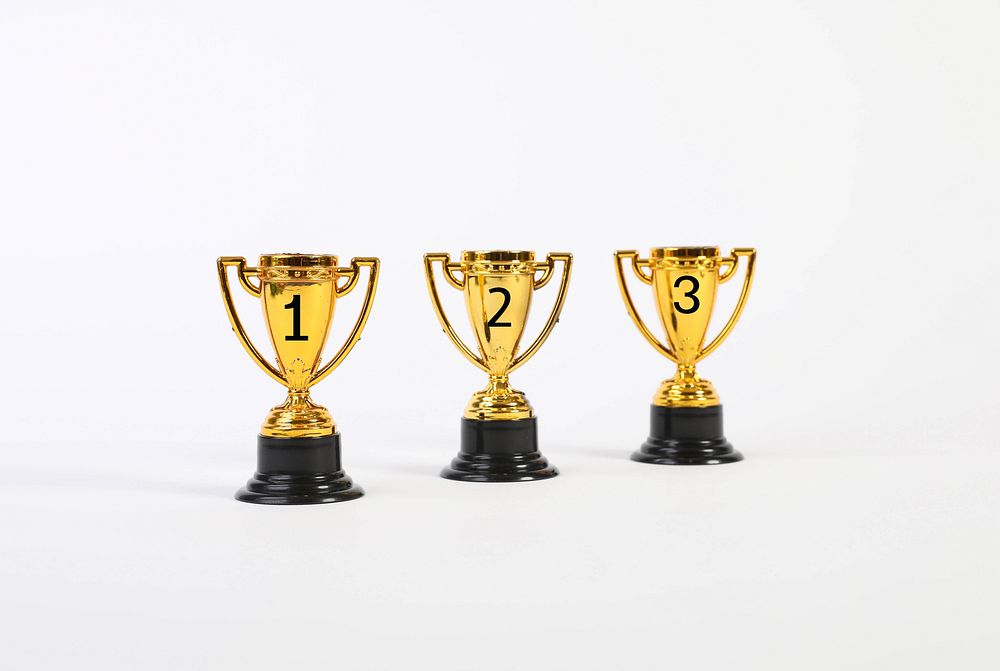Set of golden trophies on white background 