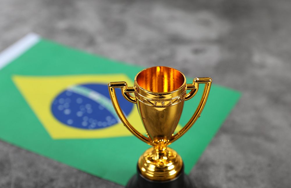 Golden trophy with flag of Brasil 