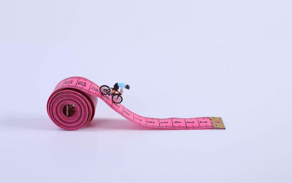 Miniature measure tape cyclist advertising.