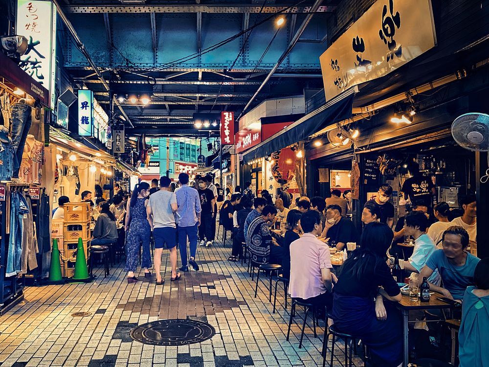 Bars & Shops, Ueno, Tokyo, JapanPeople enjoying a summer evening near Ueno Station, Taito City, Tokyo, Japan. These "under…
