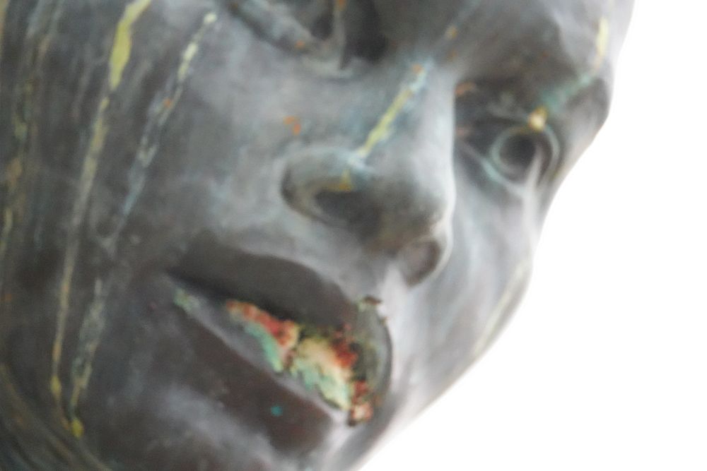 Face human sculpture installation art.