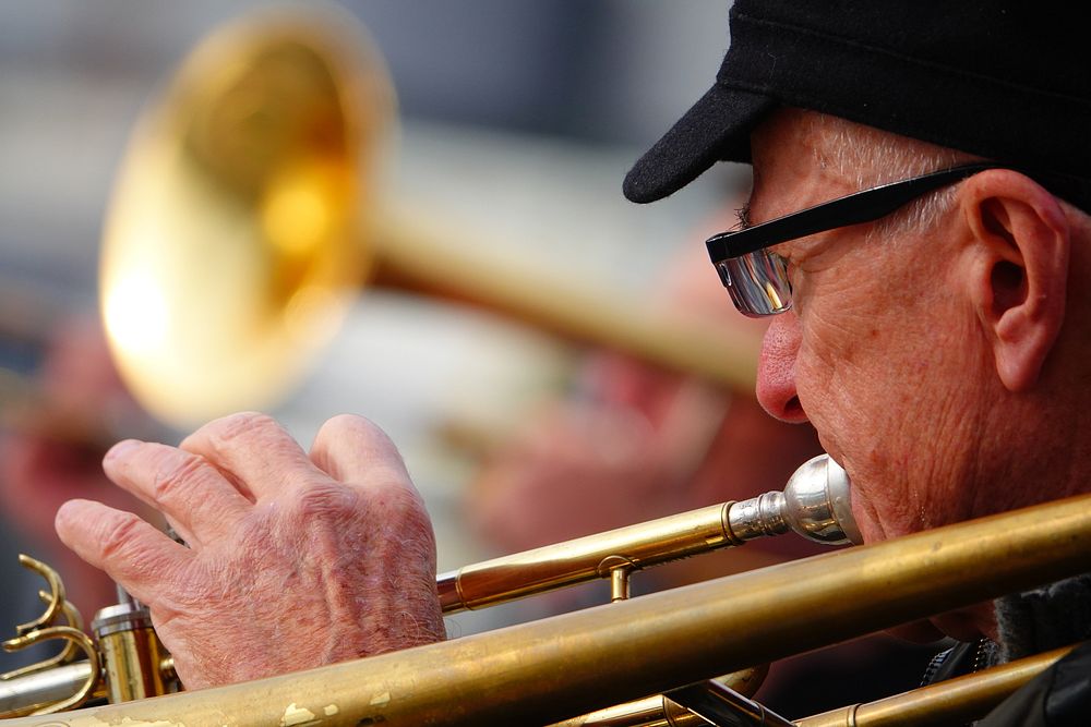 Trombone musician, musical instrument.