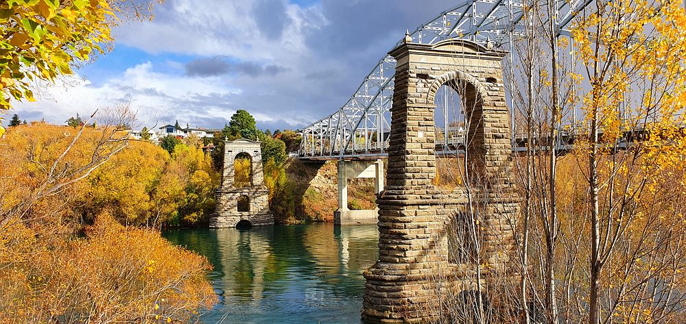 The Alexandra Bridge TowersAcross the Clutha River at Alexandra are impressive masonry piers, towers, and abutments – the…