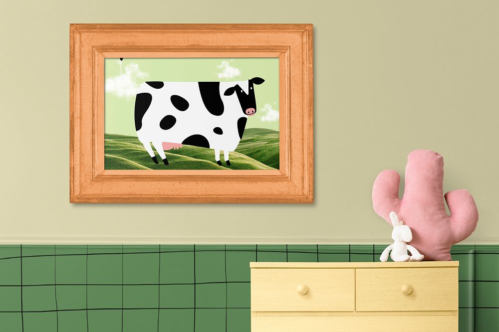 Kids room with framed cow picture and green wall
