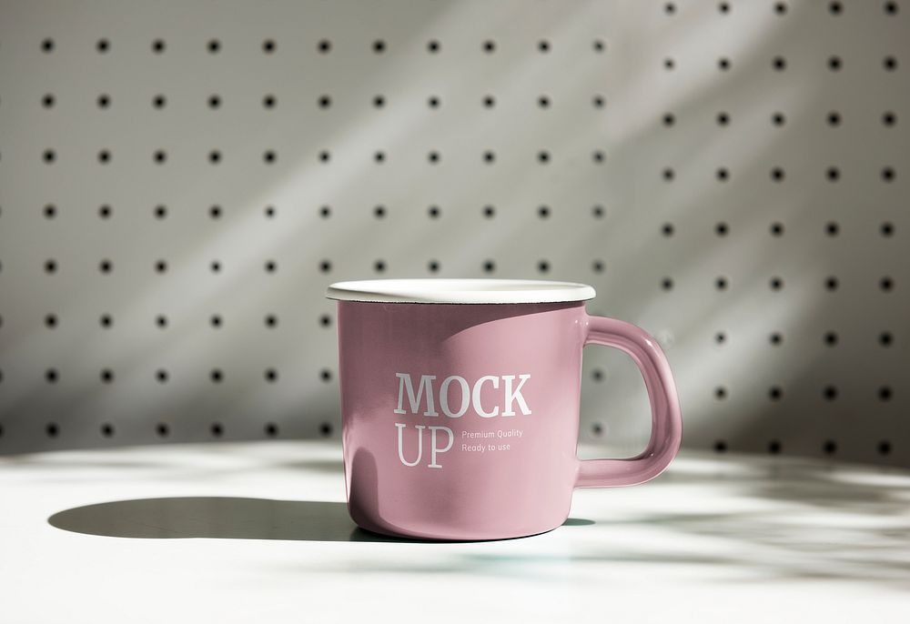 Pink mug mockup on a table