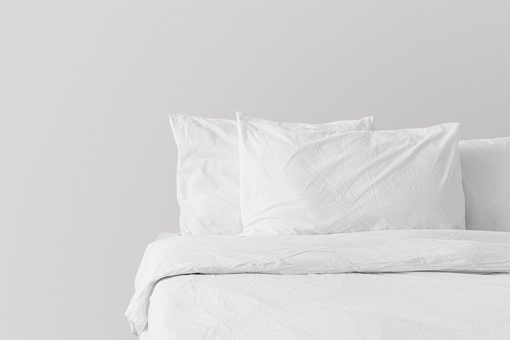 Minimal white bed linen