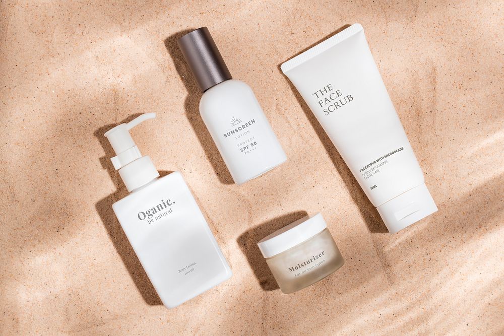 Minimal skincare bottles on sand photo