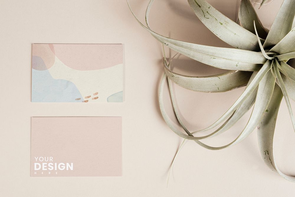 Business cards with dried leaves mockup