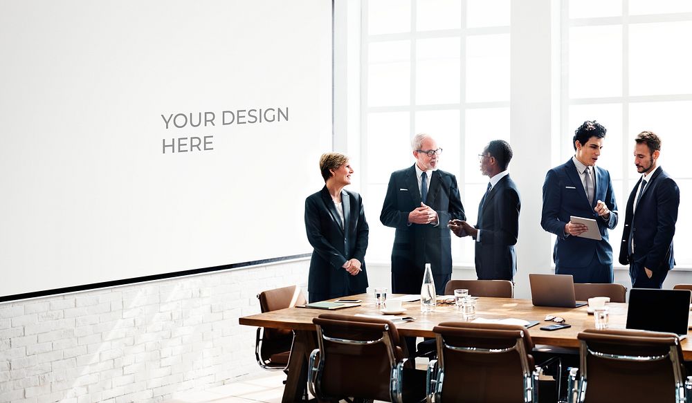 Diverse business people in a meeting with a board mockup
