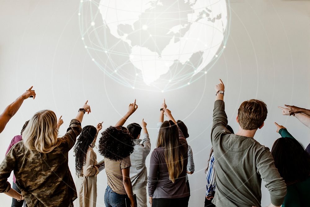 Diverse people pointing to a global network symbol