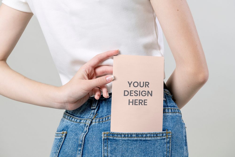 Woman keeping a flyer mockup in her pants pocket