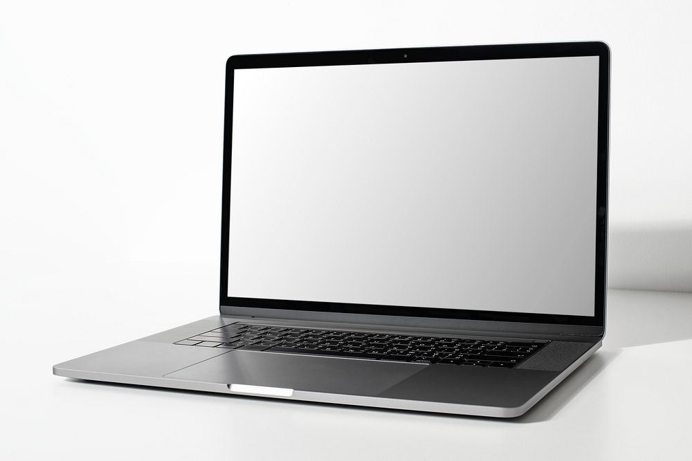 Laptop screen mockup psd on a white table