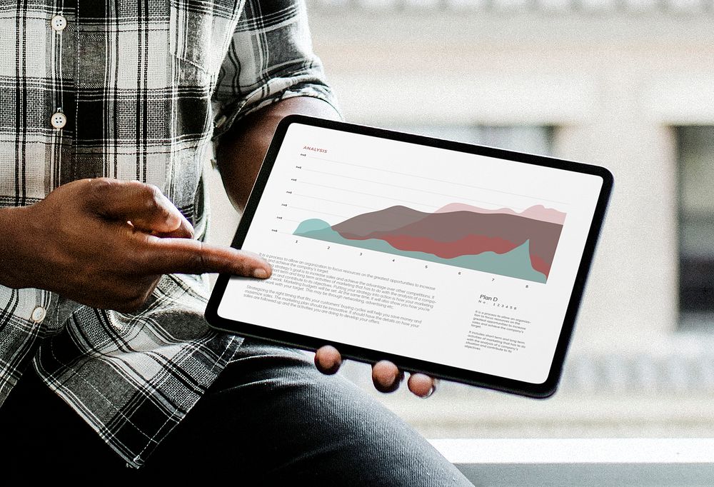 Man showing business analytics on tablet