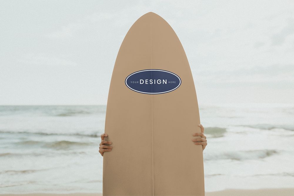 Surfer holding a surfboard mockup