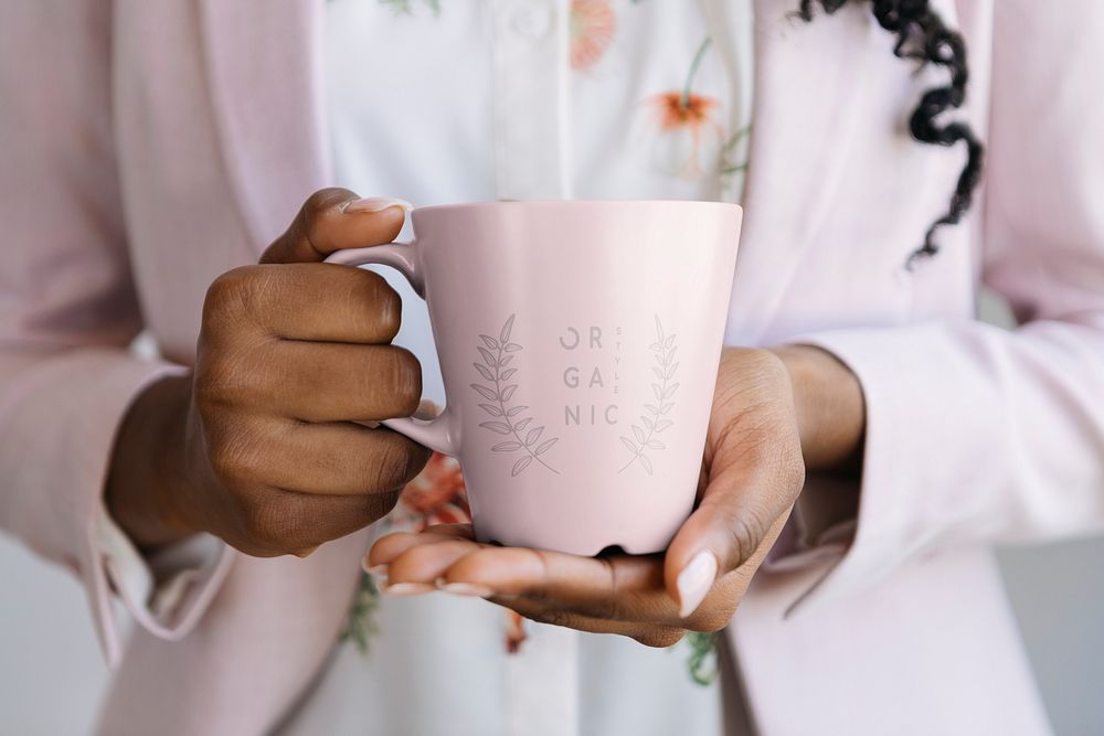 Woman holding a pink mug mockup illustration