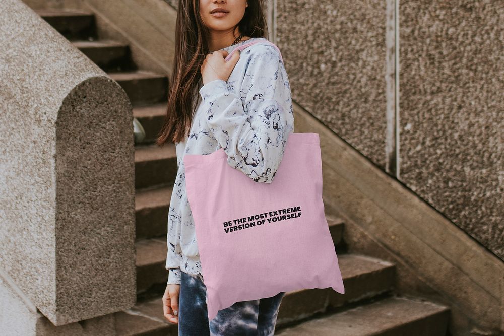 Customizable tote bag mockup, psd accessory on a confident woman