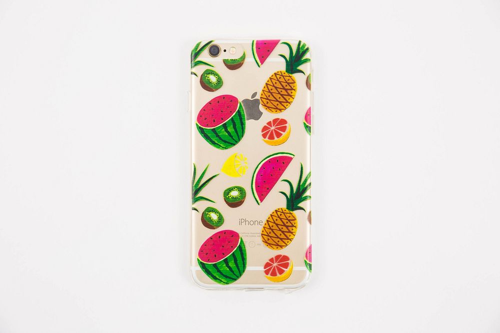 iPhone 6 in a transparent case with a variety of cute fruit illustrations.