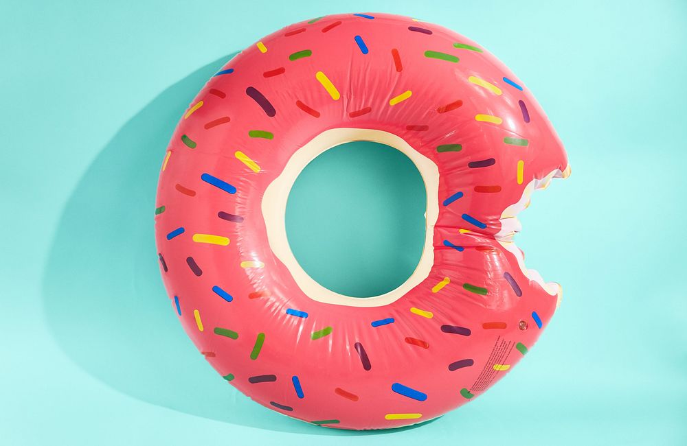 Inflatable pink donut pool toy.