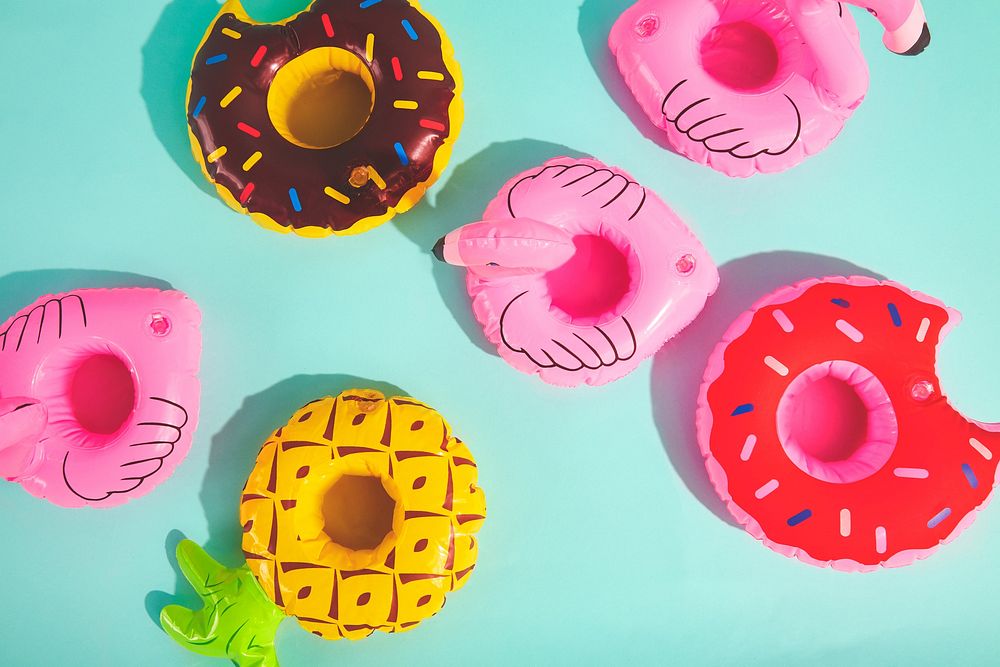 Inflatable pool  drink holders, donuts, flamingos and pineapple