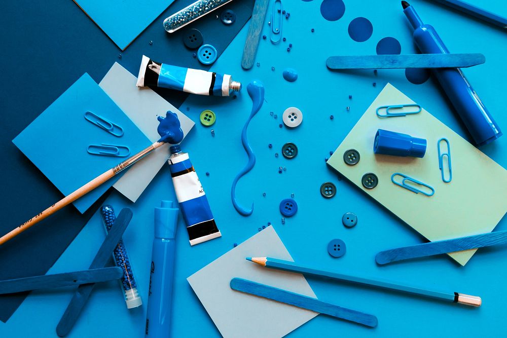 Blue arts and crafts supplies, flat lay.