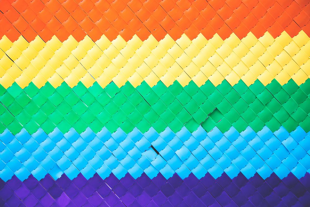 A woven plastic rainbow pattern and texture.