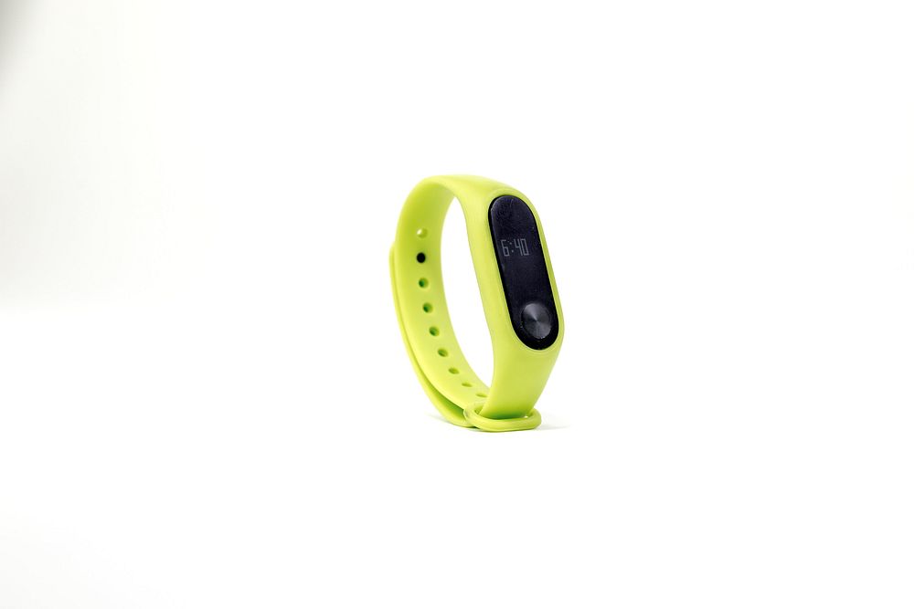 Lime green Fitbit fitness tracker. 29 JUNE 2023 - BANGKOK, THAILAND