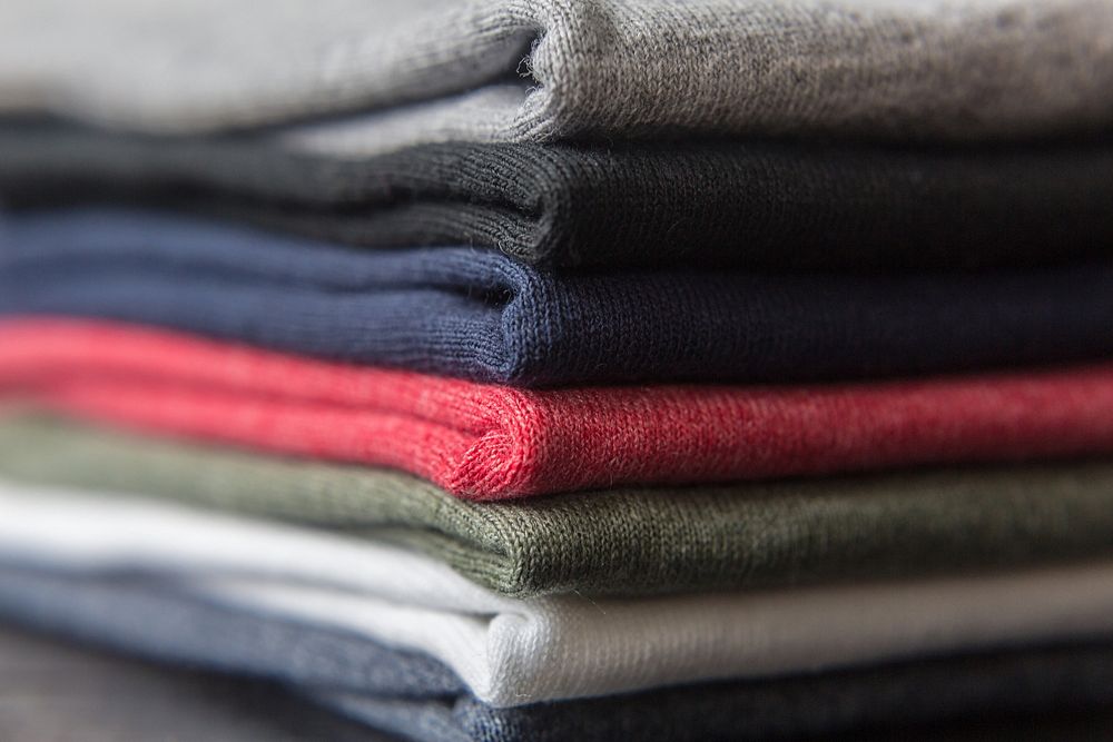 Stack of folded t-shirts.