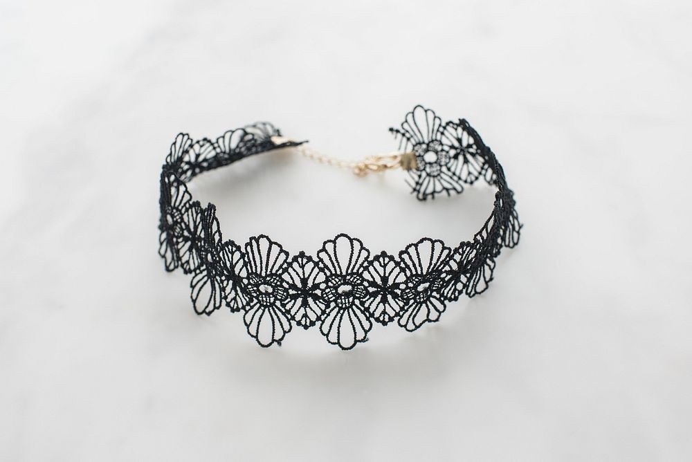 Close up view of black floral lace choker.