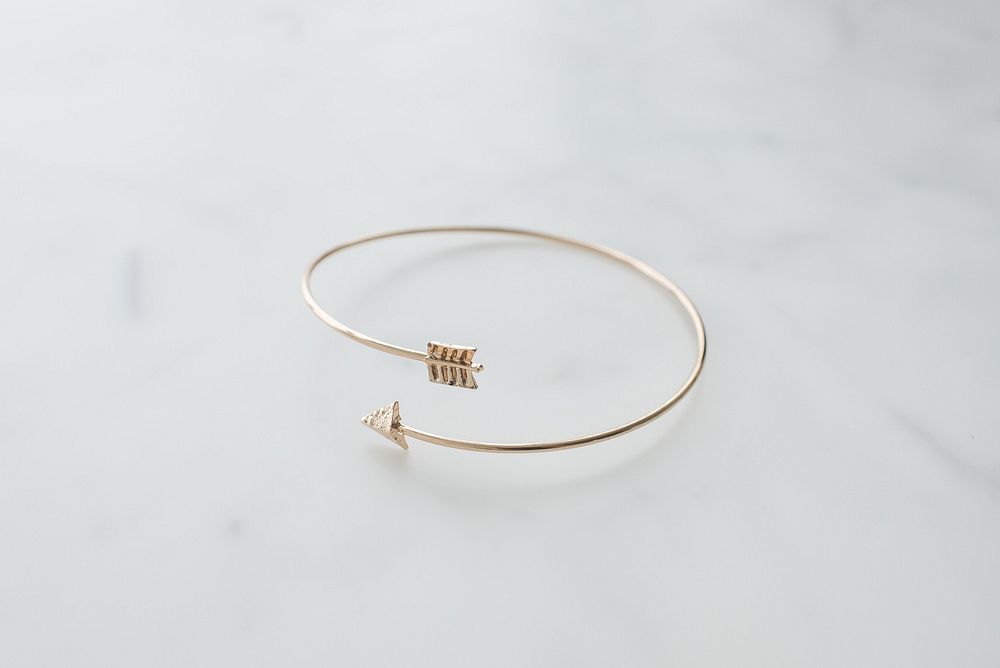 Gold arrow metal bracelet.