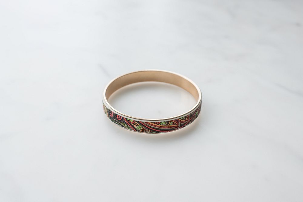 Multicolored patterned metal bangle.