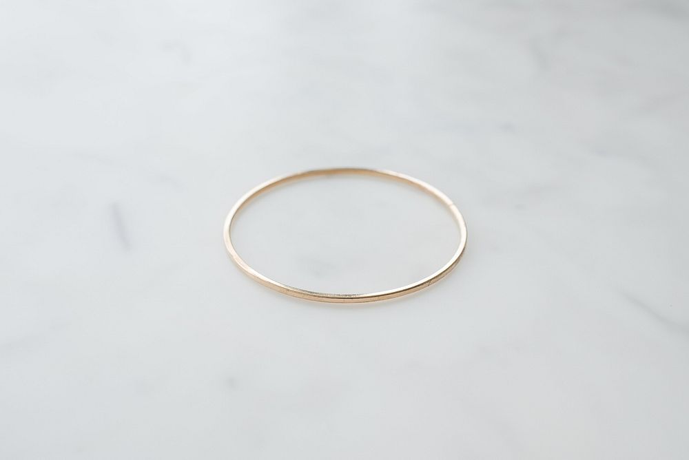 Simple gold bangle bracelet.