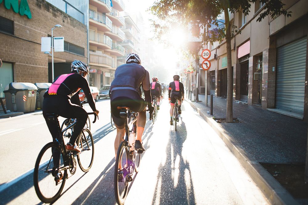 People cycling through city