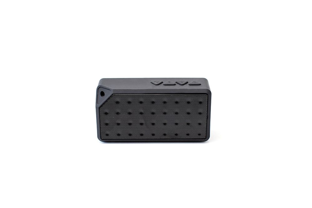 Front view of black portable bluetooth speaker.