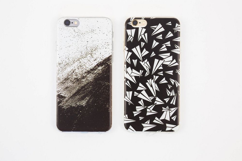 Black and white phone cases, grunge print and paper airplanes.