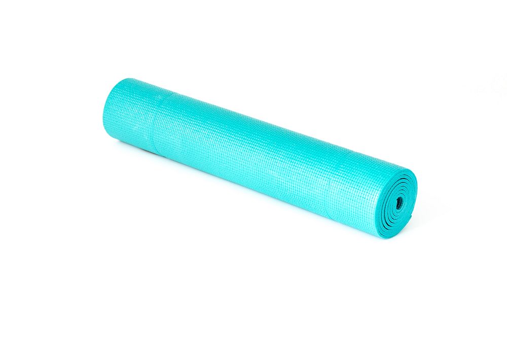 Rolled up teal yoga mat on its side.