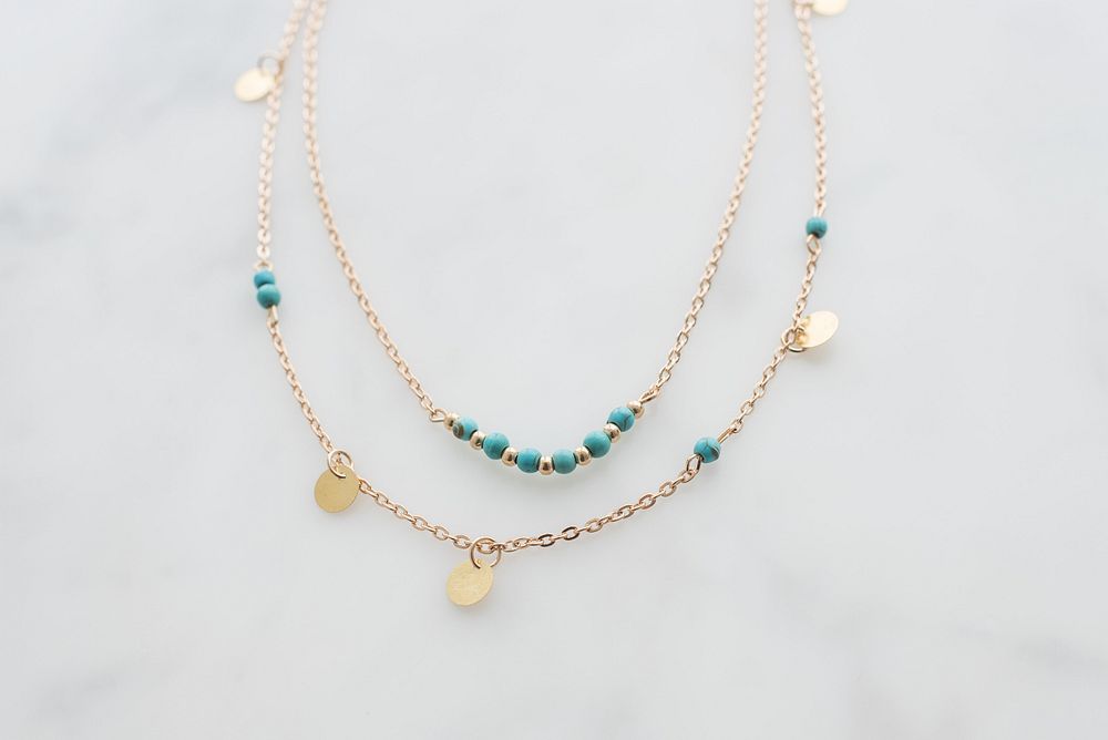 Layered gold and turquoise necklace.