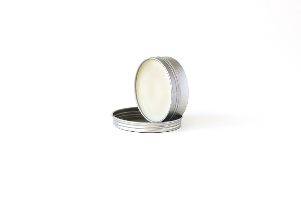 Beard balm in tin case.