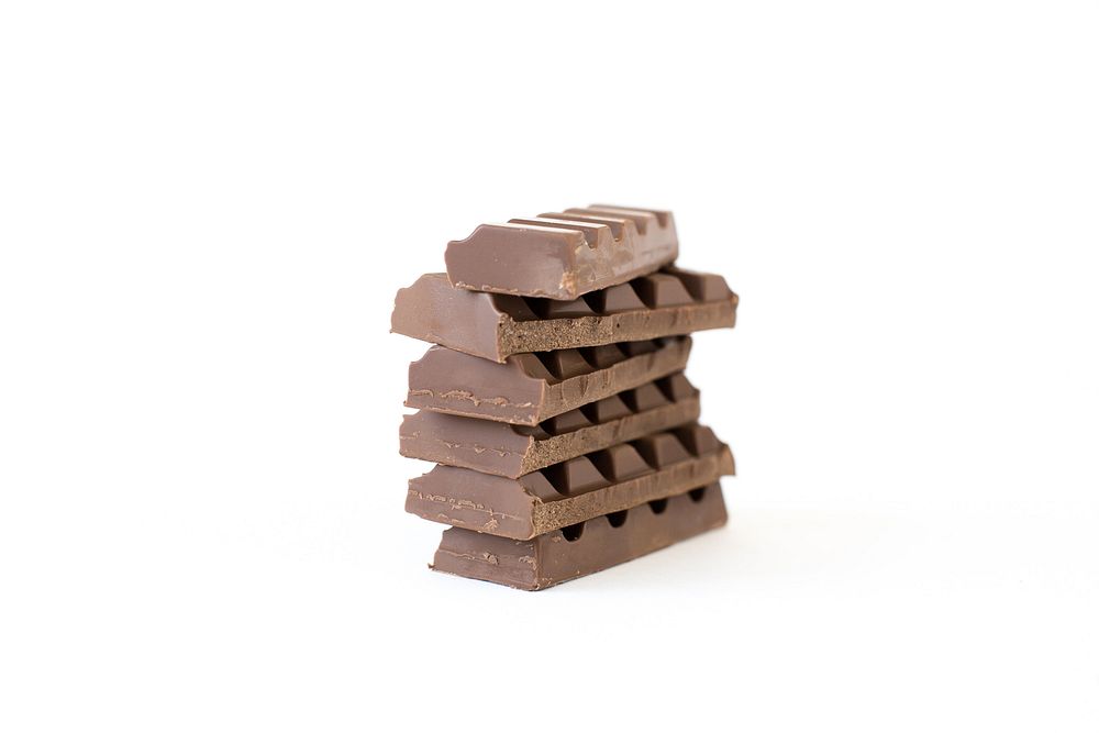 A stack of six individual rows of milk chocolate against a white background.