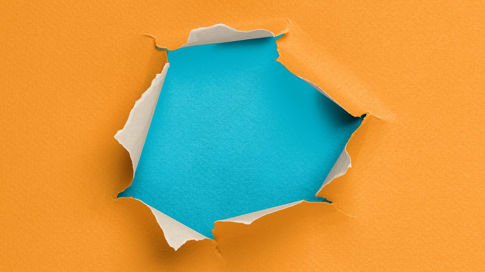 Ripped paper hole desktop wallpaper, orange background