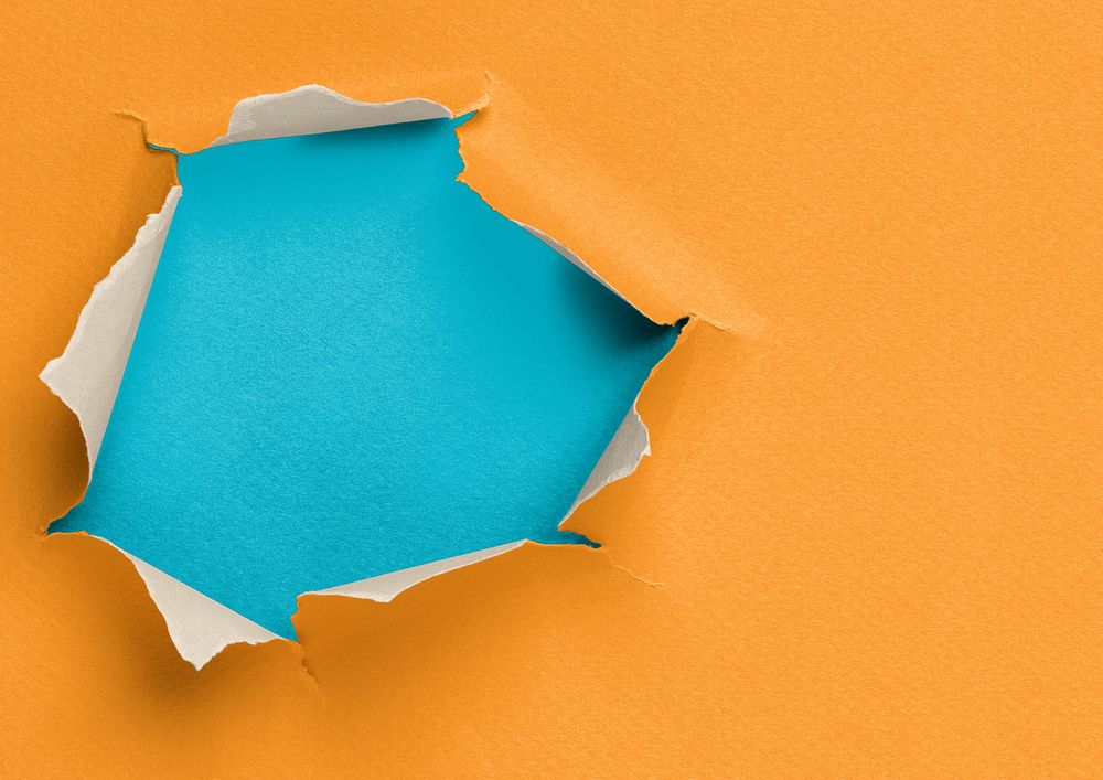 Ripped paper hole background, orange design