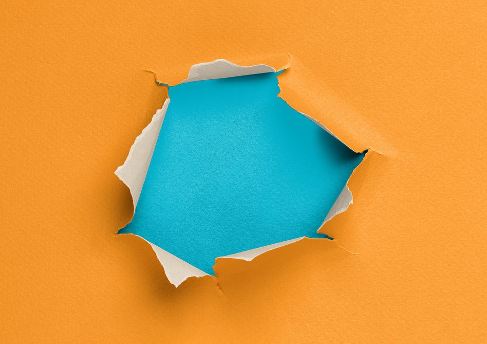 Ripped paper hole background, orange design