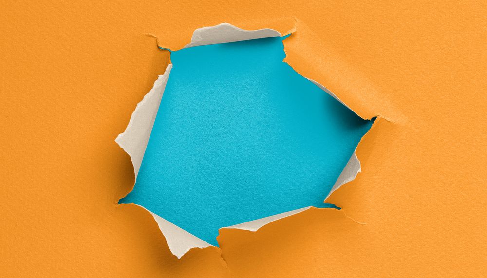 Ripped paper hole background, orange design